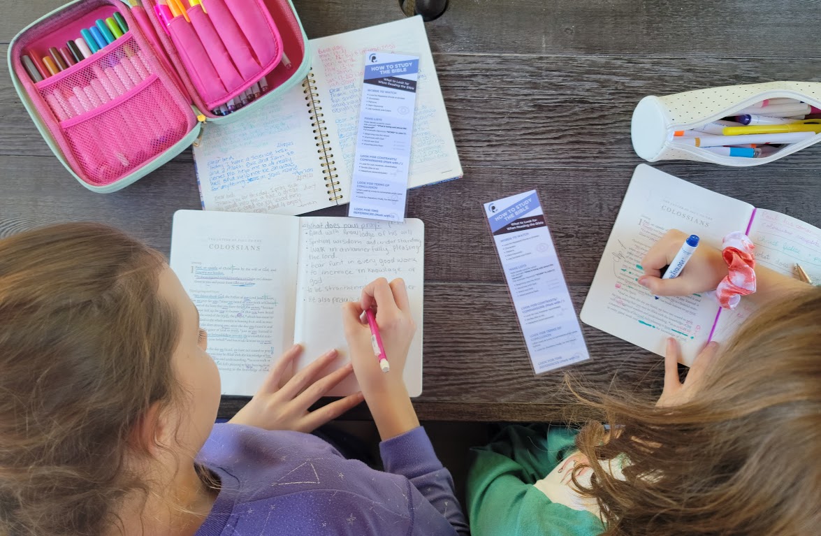 Girls studying the bible